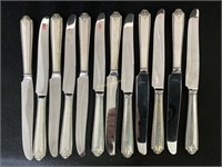 Twelve Sterling Handled Enforced Knives