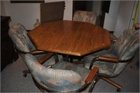 hexagon dining table w/leaf.  4 rolling chairs