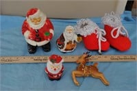 2 plastic santas, reindeer, candle, knitted boots