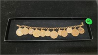14K GOLD BRACELET WITH GOLD PLATED COINS