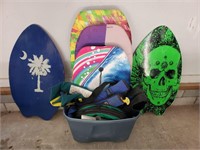 Tote of skim boards, boogie boards and more