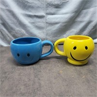 Pair happy face mugs