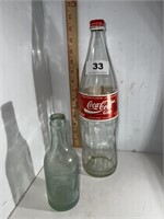 2 old glass soda bottles