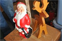 wooden reindeer with light up santa