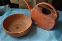 terra cota planter and watering jug for roundup