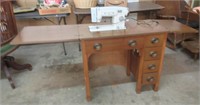 Working White Sewing Machine In Cabinet