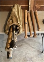 Wood and metal baseball bats