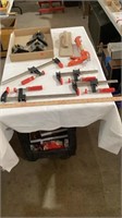 Various tool clamps, caulking gun.