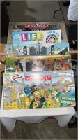 Board games including monopoly, farmopoly, life