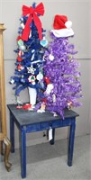 (E) 2 DECORATED CHRISTMAS TREES, TABLE, ORNAMENTS