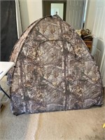 1 man, camouflaged, hunting, blind see photo