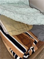 Box of linens includes towels, pillowcases,