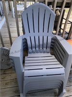 Five plastic lawn chairs