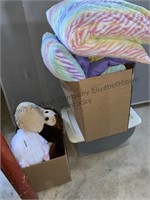 Box of decorative bed pillows, stuffed animals,