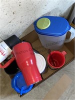 Pitcher and assortment of travel mugs