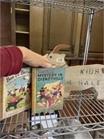Vintage children’s books and wood sign