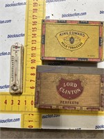 Vintage thermometer and cigar boxes