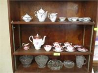 2 tea sets and candy dishes and other dishes on 3