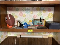 Football and contents of shelf