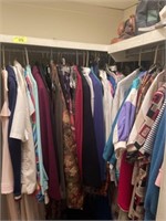 All clothes, purses and folded clothes in closet