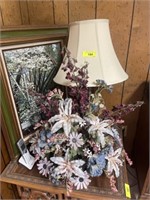 Lamp, framed art, floral arrangement