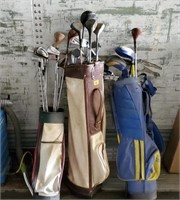 3 sets of golf clubs.