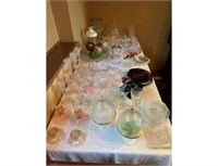Glassware contents on table and wall hanging