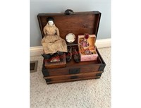 Antique wooden baby trunk with dolls