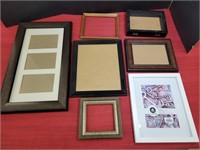 Assorted picture frames, some just frames and