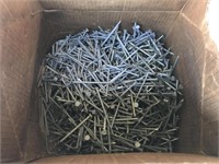 Partial box of 2.5” coated nails.