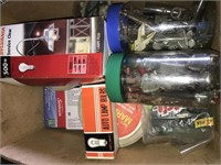Jars of binder clamps, lightbulbs and more.