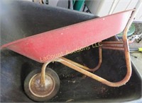 small red metal wheel barrow