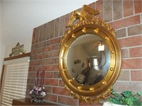 Oval mirror with eagle frame