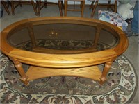 Oval oak coffee table with beveled glass