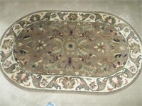 Brown oval area rug
