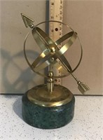 Brass astrolabe on marble base