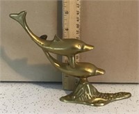 Brass dolphins sculpture