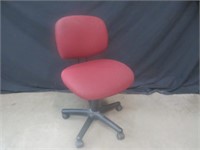 RED UPHOLSTERED OFFICE CHAIR