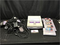 Super Nintendo with Remotes and Games