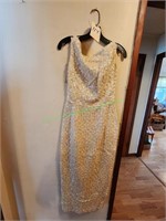 Creamed colored pagentry dress with sequins.