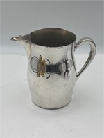 Silver on copper pitcher