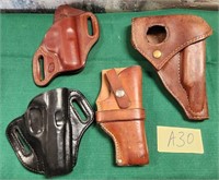 28 - LOT OF 4 LEATHER GUN HOLDERS (A30)