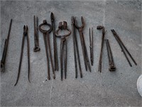 Lot of cast iron blacksmith tools.