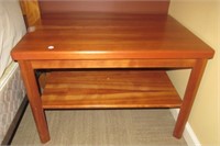 Wood end table. Measures:  20" H x 29 1/2" W x 21