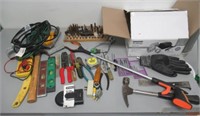 Lot of hand tools including hammer, tape measure,