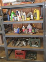 Shelf with contents that includes garage liquids,