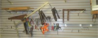Contents of wall that includes grease gun, hand