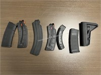 6-various magazines and gun accessories
