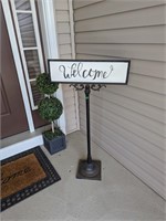Welcome sign and mat