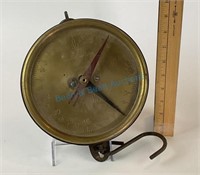 Antique brass hanging scale measuring 8 inches in